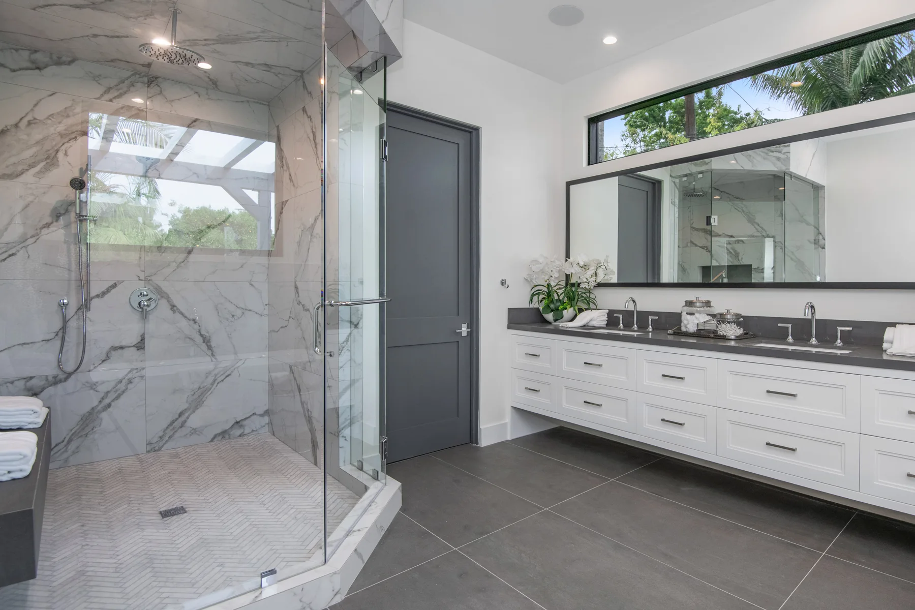 A-BATHROOM-WITH-MARBLE-TILE-AND-DOUBLE-VANITY-TOPS-2024-05-10-17-51-25-UTC